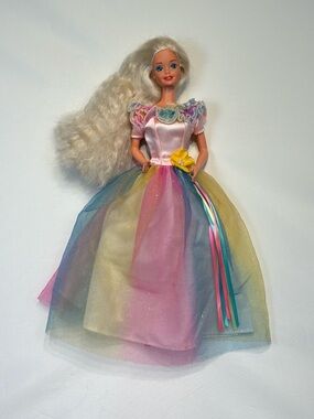 1980/1990s Barbie wearing a vintage 1997 Birthday Barbie doll